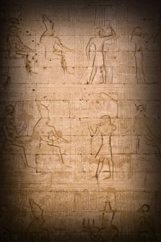 Closeup on ancient hieroglyphs in egyptian temple with surrounding shade