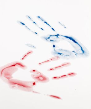 Blue and red hand-print shape over white background