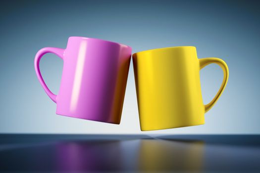 An image of two weightless coffee mugs