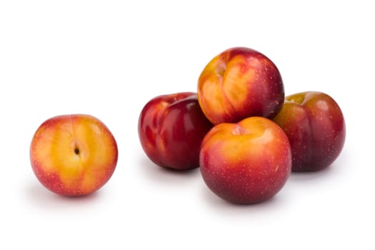 Group of plums isolated on white background