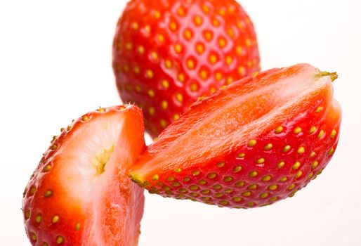 Fresh strawberry sliced and falling