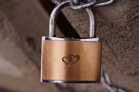 Heart on bronze padlock