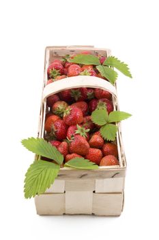 Fresh juicy strawberries in wooden basket isolated on white