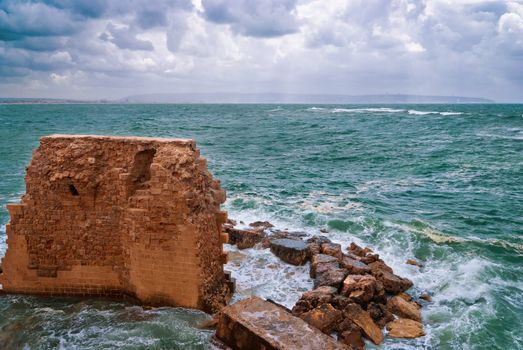 Remains of fortress walls of the Acre and the Mediterranean Sea