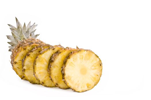 Ripe fruits pineapple with slices isolated on white