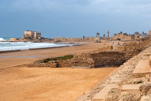 Ruins of the ancient Romanian harbor, Caesarea, Israel .