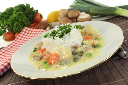 a plate with rice and colorful chicken fricassee