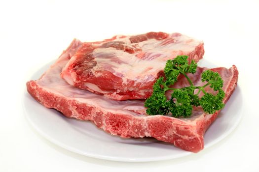 two pieces of spare ribs on a white background