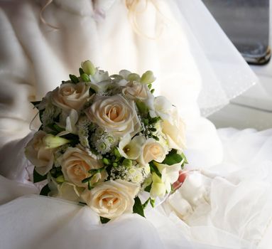 The bride with a bouquet in the retro automobile. 