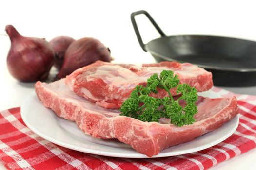 two pieces of spare ribs on a white background