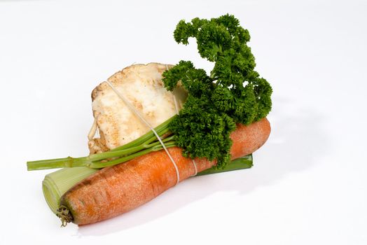 Mirepoix - standard fresh herbs and roots for soup isolated on white background
