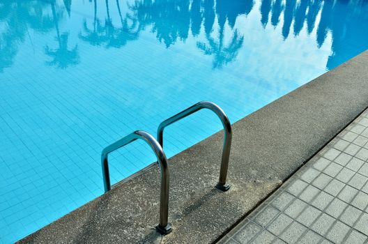 Swimming pool with tree reflected