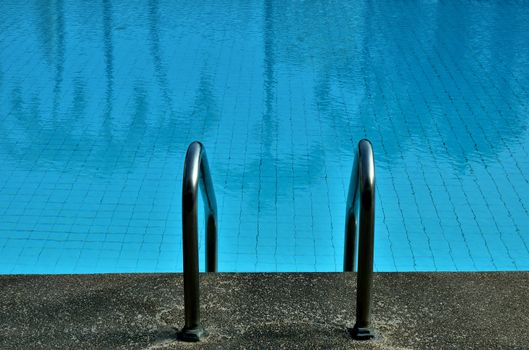 Swimming pool with tree reflected