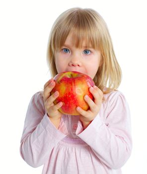 Little beauty girl eating big red apple. Isolated white background