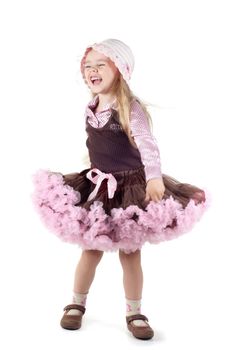 Shot of little laughing girl with long blond hair in studio