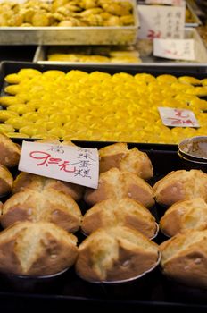 a chinese bakery presenting their buns and cakes