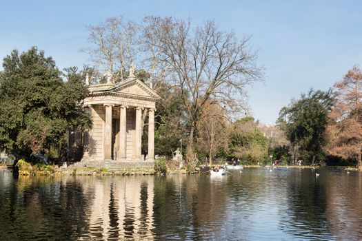 ROME, ITALY - 27 JANUARY: Local families row on lake at in Rome on 27 January 2013. The gardens were given to public in 1903.