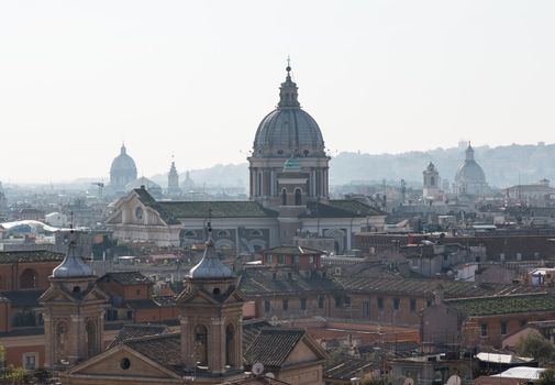 Basilica church of San Carlo al Corso in the skyline of Rome Italy with smog in the distance