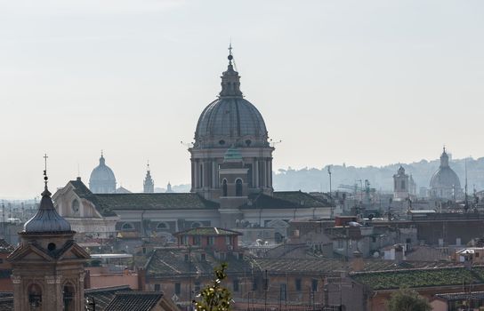 Basilica church of San Carlo al Corso in the skyline of Rome Italy with smog in the distance