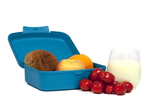 lunchbox with bread and fruit and a glass drink