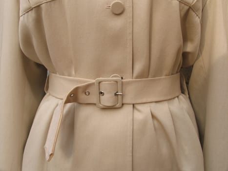 Closeup of retro female trnch coat.