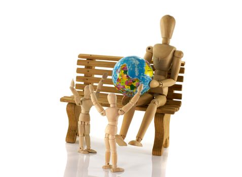 man on bench looking for travel destination with the wooden children happy