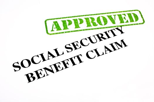 A close-up of an APPROVED Social Security Benefit Claim document.