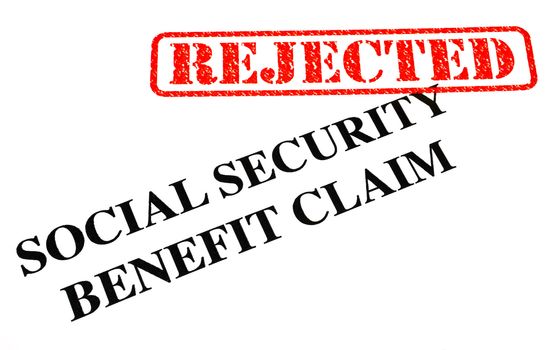 A close-up of a REJECTED Social Security Benefit Claim document.