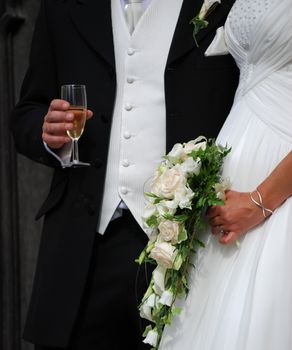 Close-up of bride and groom outside of church 