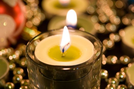 Burning candle on a background blur