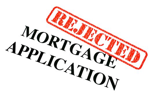 A close-up of a REJECTED Mortgage Application document.