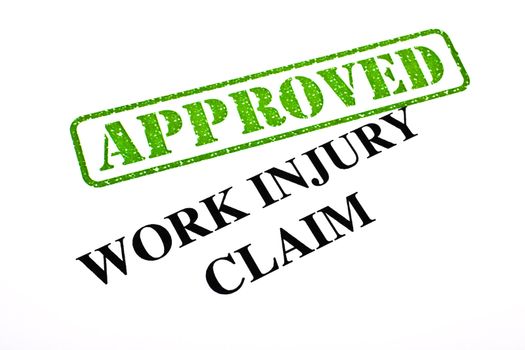 A close-up of an APPROVED Work Injury Claim document.