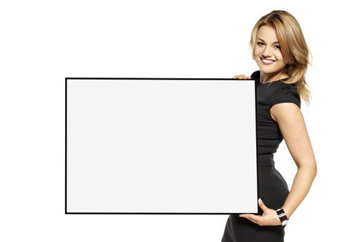Attractive young woman holding up a poster. Isolated on white background.