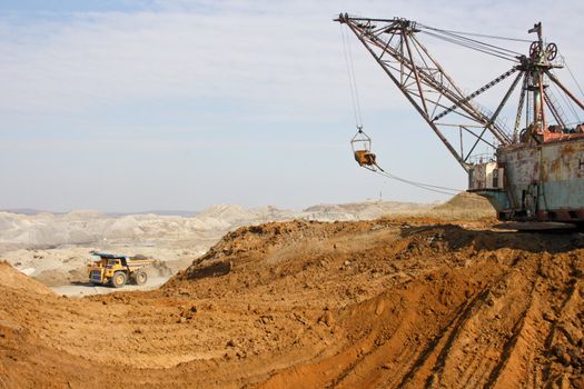 Powerful dredge and passing by lorry