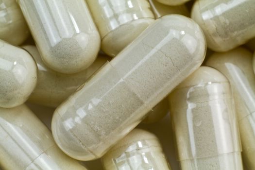 Close up of a pile of white captual pills. Close up of a pile of white captual pills.