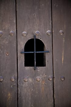 Viewing portal in an ancient european door.