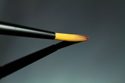 Close up of an artists paint brush.