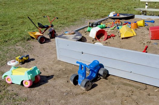  The left toys near a sandbox, taken as clouseup. 