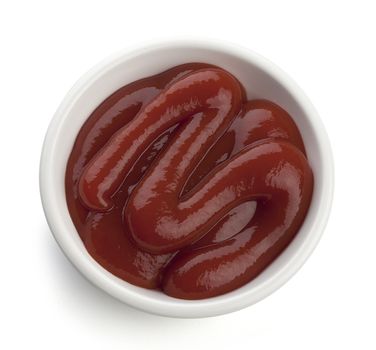 Some red tomato ketchup in the white plate