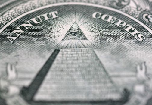 close up of Eye of Providence on one hundred dollars banknote