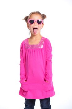 Portrait of little fashion girl in pink dress and sunglasses. Isolated white backround.