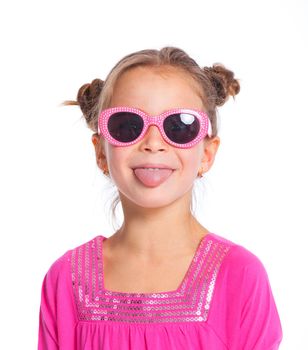 Portrait of little fashion girl in pink dress and sunglasses. Isolated white backround.