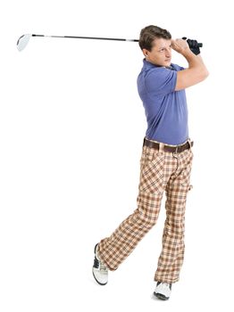 Photo of a male golfer in his late twenties finishing his swing with a driver.
