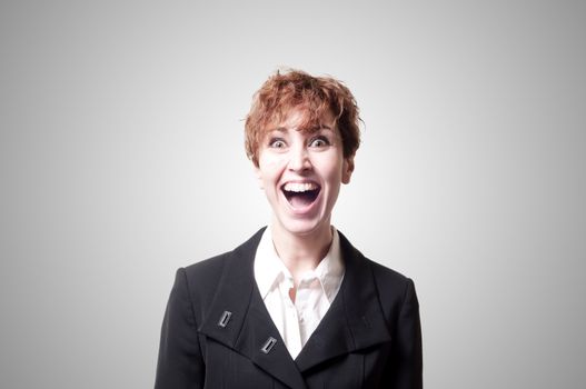 screaming success short hair business woman on gray background