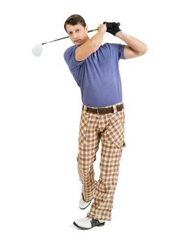 Photo of a male golfer in his late twenties finishing his swing with a driver.
