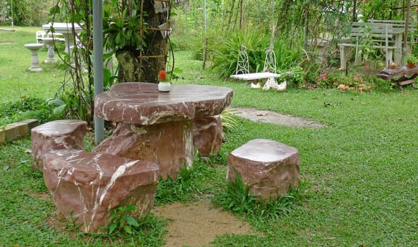 Garden table and four chairs, made from stone