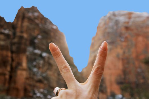 Female hand on a background the Zion national park in Utah on winter