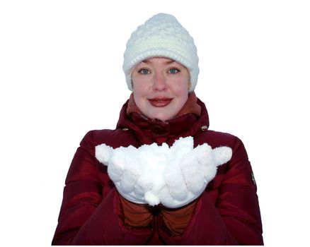 Girl clad in a red jacket and white hat, holds the snow on the hands on a white background.