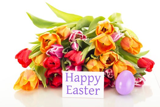 Bunch of tulips with easter egg and card: happy easter
