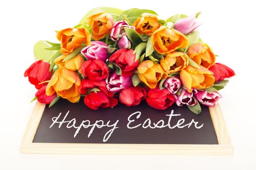 Bunch of tulips with blackboard: happy easter